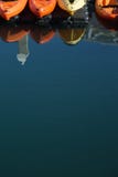 Four Kayaks in water with reflections royalty free stock photos Four Kayaks in water with reflections royalty free stock photos