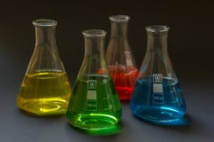Four laboratory flasks with liquids. royalty free stock photos Four laboratory flasks with liquids. royalty free stock photos