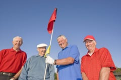 Four Men Standing On Course Royalty Free Stock Image Four Men Standing On Course Royalty Free Stock Image