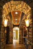 Foyer with stone archway in home.