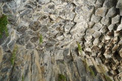 Fragment of granite rock formed by hexagonal structures! stock images Fragment of granite rock formed by hexagonal structures! stock images