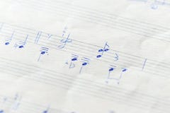 Fragment of an old musical notebook with hand written notes