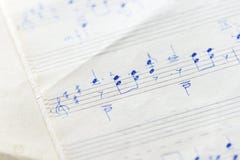 Fragment of an old musical notebook with hand written notes