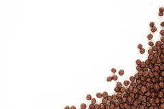 Frame Corn Flakes Chocolate Balls Isolated Top View on White Bac royalty free stock images Frame Corn Flakes Chocolate Balls Isolated Top View on White Bac royalty free stock images