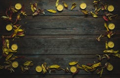 Frame made of dried flower petals and candles stock photos Frame made of dried flower petals and candles stock photos