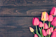 Frame Of Tulips On Dark Rustic Wooden Background. Spring Flowers Royalty Free Stock Image Frame Of Tulips On Dark Rustic Wooden Background. Spring Flowers Royalty Free Stock Image