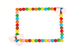 Frame of various colorful candy on white background stock photos Frame of various colorful candy on white background stock photos