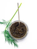 Frasco com caviar preto e uma colher de prata Espa?o livre para o texto Vista superior imagem de stock Frasco com caviar preto e uma colher de prata Espa?o livre para o texto Vista superior imagem de stock
