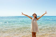 Freedom woman in free happiness bliss on beach. Smiling happy girl in white summer dress in vacation outdoors stock photos Freedom woman in free happiness bliss on beach. Smiling happy girl in white summer dress in vacation outdoors stock photos