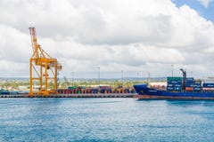 Freighter And Crane At Barbados Port Stock Photo