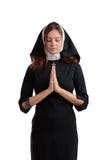 Freira consideravelmente nova no conceito da religião isolada em um fundo branco fotografia de stock royalty free Freira consideravelmente nova no conceito da religião isolada em um fundo branco fotografia de stock royalty free