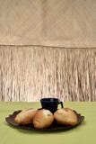 French bread, on plate with black cup in background stock photos French bread, on plate with black cup in background stock photos