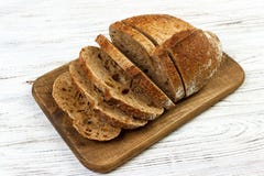 French sliced bread on wooden cutting board royalty free stock photography French sliced bread on wooden cutting board royalty free stock photography