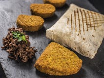 Close up on French Tacos with Nuggets, Cordon bleu and Beef on slate stock images Close up on French Tacos with Nuggets, Cordon bleu and Beef on slate stock images
