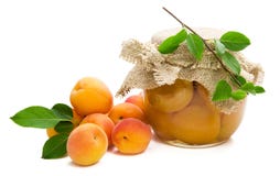 Fresh apricots with green leaves,jam in glass jar stock photo Fresh apricots with green leaves,jam in glass jar stock photo