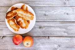 Fresh baked pastries filled with vegetables and cheese on wooden background. stock photography Fresh baked pastries filled with vegetables and cheese on wooden background. stock photography
