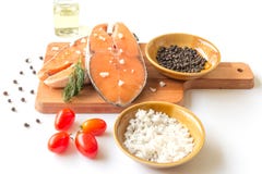 Fresh fish salmon raw salmon steak with sea salt pepper and Dill Weed isolated on a white background stock photography Fresh fish salmon raw salmon steak with sea salt pepper and Dill Weed isolated on a white background stock photography