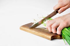 Fresh green garlic on the board with a knife stock photo Fresh green garlic on the board with a knife stock photo