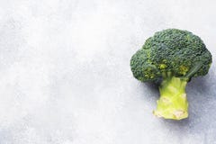 Fresh Head Of Broccoli On Grey Concrete Table. Copy Space Stock Photo