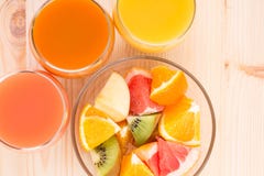 Fresh Juices In Three Glasses With Fruit Salad. Stock Images
