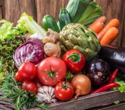 Fresh multi-colored vegetables in wooden crate. Royalty Free Stock Images Fresh multi-colored vegetables in wooden crate. Royalty Free Stock Images