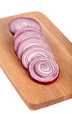 Fresh Onion Slices On A Wooden Board Stock Image