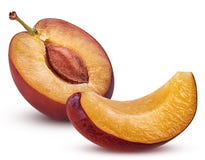 Fresh plum cut in half with bone and slice Royalty Free Stock Photography Fresh plum cut in half with bone and slice Royalty Free Stock Photography