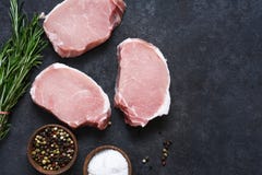 Fresh Pork Steak On A Black Concrete Background. Ingredients For Cooking Stock Photography