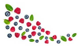 Fresh raspberries and blueberries with leaves isolated on white background. Berry ornament stock images Fresh raspberries and blueberries with leaves isolated on white background. Berry ornament stock images