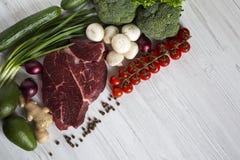 Fresh raw meat beef steak with spices, cherry tomatoes, health f royalty free stock photos Fresh raw meat beef steak with spices, cherry tomatoes, health f royalty free stock photos