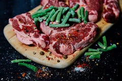 Fresh raw meat pork neck on wooden Board on black table royalty free stock images Fresh raw meat pork neck on wooden Board on black table royalty free stock images