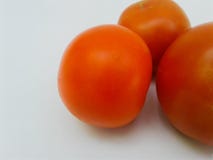 Fresh red tomatoes on white background. Side view stock images Fresh red tomatoes on white background. Side view stock images