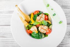 Fresh salad with chicken breast, baby spinach, basil, cherry tomatoes, pear, cucumber on plate on wooden background close up. Stock Photography Fresh salad with chicken breast, baby spinach, basil, cherry tomatoes, pear, cucumber on plate on wooden background close up. Stock Photography