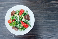 Fresh salad with slices of meat. background wooden royalty free stock images Fresh salad with slices of meat. background wooden royalty free stock images