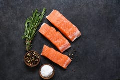 Fresh Salmon Filet And Spices On A Concrete Black Background. Stock Image