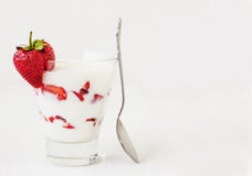 Fresh strawberry on a glass with dessert yogurt and strawberry l royalty free stock photography Fresh strawberry on a glass with dessert yogurt and strawberry l royalty free stock photography