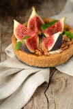 Fresh tart or pie with figs, cream and mint royalty free stock image Fresh tart or pie with figs, cream and mint royalty free stock image