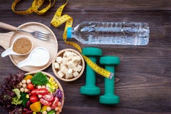 Fresh vegetable salad and healthy food for sport equipment for women diet slimming with measure tap for weight loss. royalty free stock photos Fresh vegetable salad and healthy food for sport equipment for women diet slimming with measure tap for weight loss. royalty free stock photos