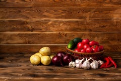 Fresh vegetables on a brown wooden background stock image Fresh vegetables on a brown wooden background stock image