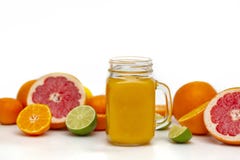 Freshly blended yellow and orange fruit smoothie in glass jar. Glass jar mugs with orange health smoothie, lime, grapefruit, lemon stock photo Freshly blended yellow and orange fruit smoothie in glass jar. Glass jar mugs with orange health smoothie, lime, grapefruit, lemon stock photo