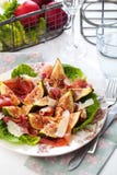 Freshly cut Fig Fruit salat with ham on the wooden background stock photo Freshly cut Fig Fruit salat with ham on the wooden background stock photo