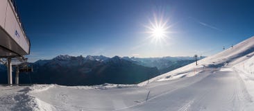 Freshly prepared ski slope and ski area with lifts and slopes stock photo Freshly prepared ski slope and ski area with lifts and slopes stock photo