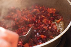 Fried beet slices on a cast-iron frying pan. stock photos Fried beet slices on a cast-iron frying pan. stock photos