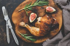 Fried Chicken Leg With A Crispy Crust With Figs And Rosemary. Stock Image