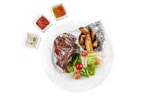 Fried entrecote with French fries on the white plate stock images Fried entrecote with French fries on the white plate stock images