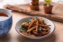 Fried insects - Bamboo worm insect crispy with pandan after fried and add a light coating of sauce and garnish Thai pepper powder stock image Fried insects - Bamboo worm insect crispy with pandan after fried and add a light coating of sauce and garnish Thai pepper powder stock image