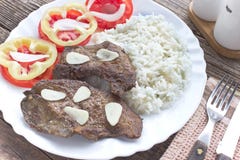 Fried pork liver in plate with vegetable salad Royalty Free Stock Image Fried pork liver in plate with vegetable salad Royalty Free Stock Image