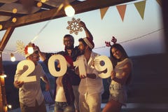 Friends at a New Year`s Eve party by the pool royalty free stock photos Friends at a New Year`s Eve party by the pool royalty free stock photos