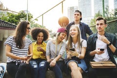 Friends in the park looking using smartphones millennial and you royalty free stock image Friends in the park looking using smartphones millennial and you royalty free stock image