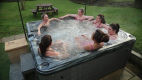 Friends Relaxing in a Hot Tub
